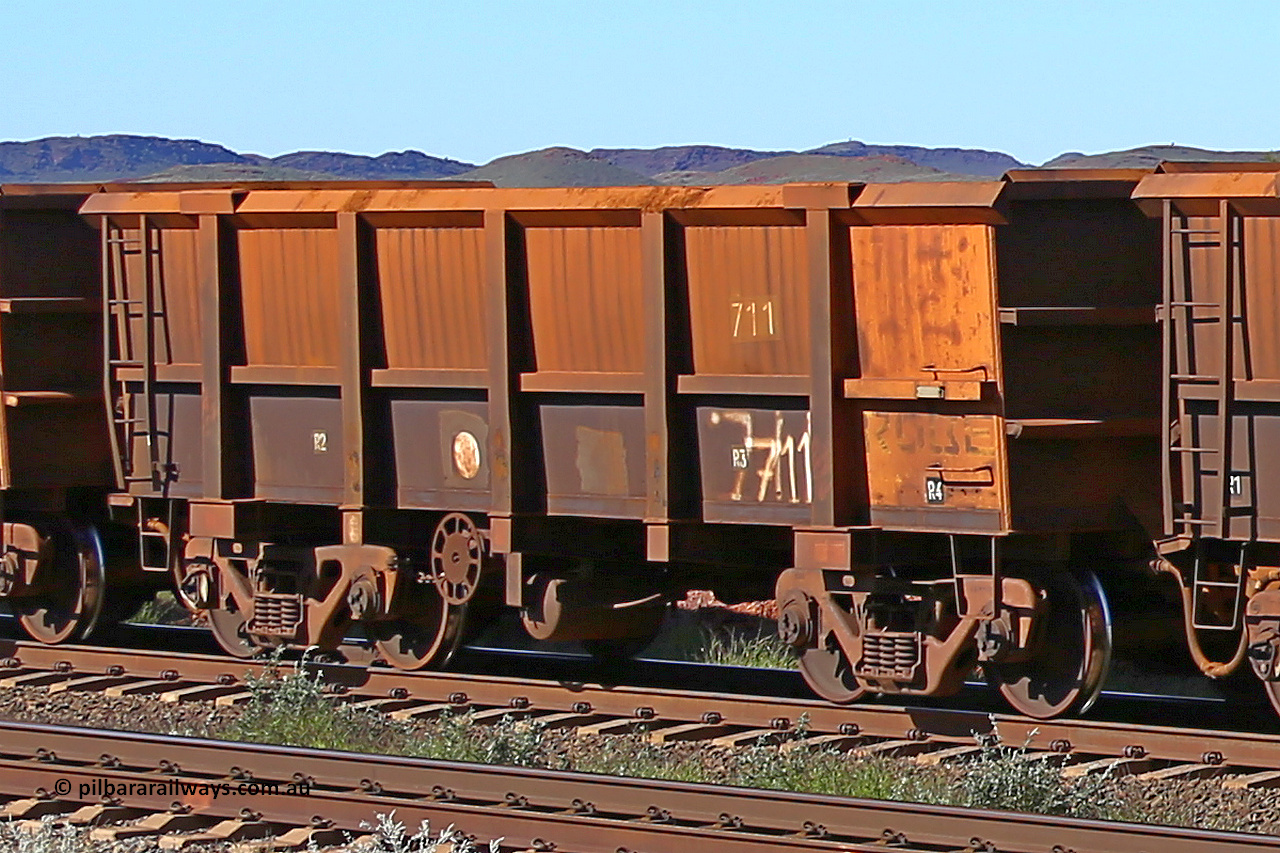 0711 160727 0964
Robe River ore waggon 711, built by Tomlinson Steel WA, rotary coupler end handbrake side empty view at Harding Siding on the Cape Lambert line, July 27, 2016.
Keywords: 711;Tomlinson-Steel-WA;Robe-ore-waggon;