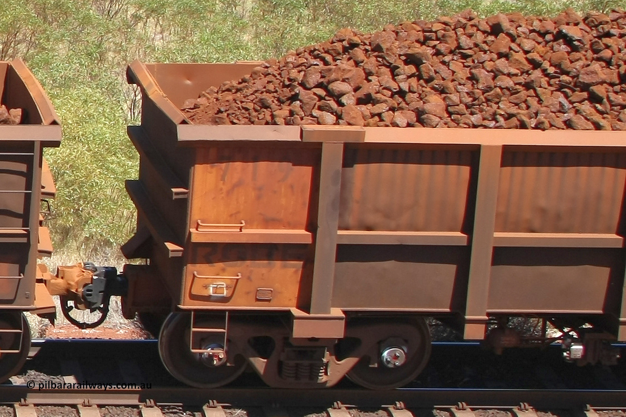0719 081209 0110
Robe River ore waggon 719, built by Tomlinson Steel WA, rotary coupler end non-handbrake side panel and plate, loaded view at the 7 km location just south of Cape Lambert yard. December 9, 2008.
Keywords: 719;Tomlinson-Steel-WA;Robe-ore-waggon;