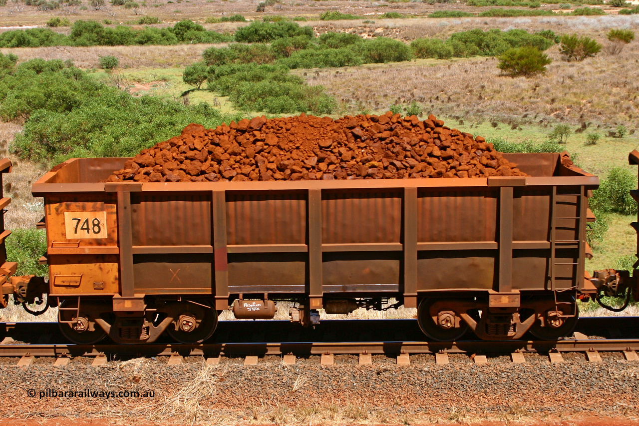 0748 061209 8189
Robe River ore waggon 748, built by Tomlinson Steel WA, non-handbrake side loaded view at the 7 km location just south of Cape Lambert yard. December 9, 2006.
Keywords: 748;Tomlinson-Steel-WA;Robe-ore-waggon;