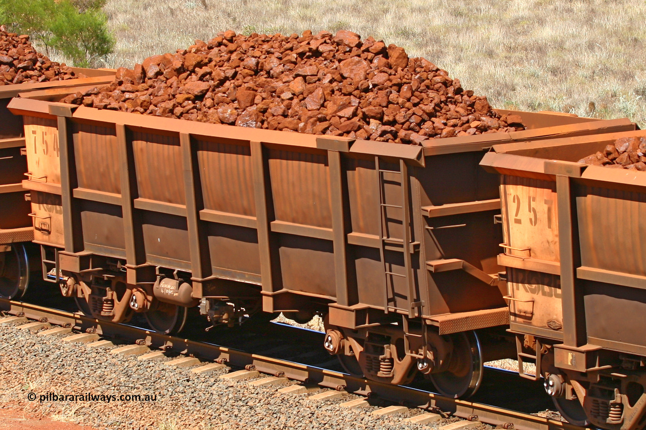 0754 061209 8179
Robe River ore waggon 754, built by Centurion Industries WA, fixed coupler non-handbrake side loaded view at the 7 km location just south of Cape Lambert yard. December 9, 2006.
Keywords: 754;Centurion-Industries-WA;Robe-ore-waggon;