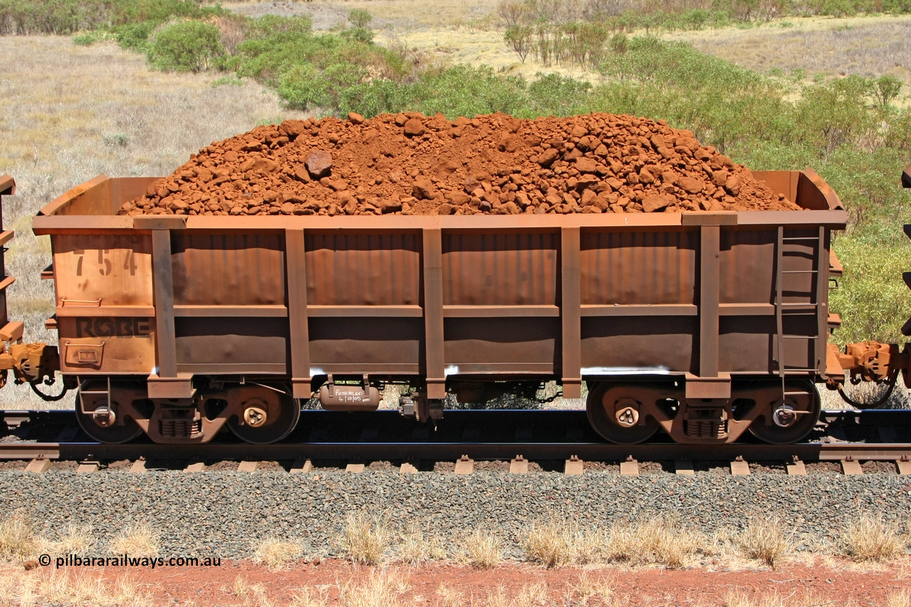 0754 081209 0143
Robe River ore waggon 754, built by Centurion Industries WA, non-handbrake side loaded view at the 7 km location just south of Cape Lambert yard. December 9, 2008.
Keywords: 754;Centurion-Industries-WA;Robe-ore-waggon;
