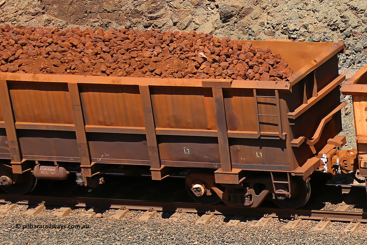 0762 160306 1659
Robe River ore waggon 762, built by Centurion Industries WA, fixed coupler non-handbrake side loaded partial view showing drop rib end, at the 45 km, Harding Siding on the Cape Lambert line. March 6, 2016.
Keywords: 762;Centurion-Industries-WA;Robe-ore-waggon;
