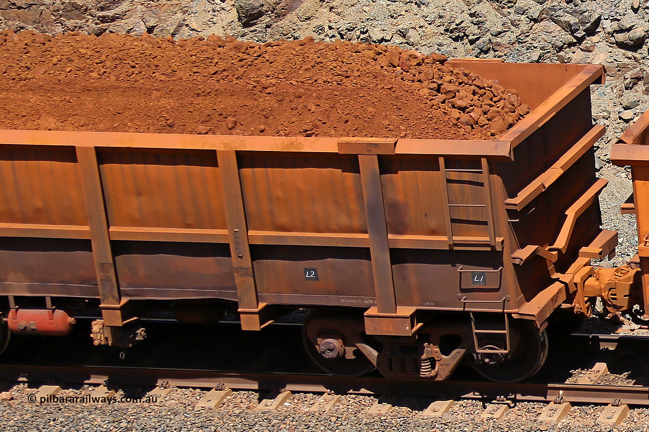 0765 160306 1606
Robe River ore waggon 765, built by Centurion Industries WA, fixed coupler non-handbrake side loaded view showing drop rib end, at the 45 km, Harding Siding on the Cape Lambert line. March 6, 2016.
Keywords: 765;Centurion-Industries-WA;Robe-ore-waggon;