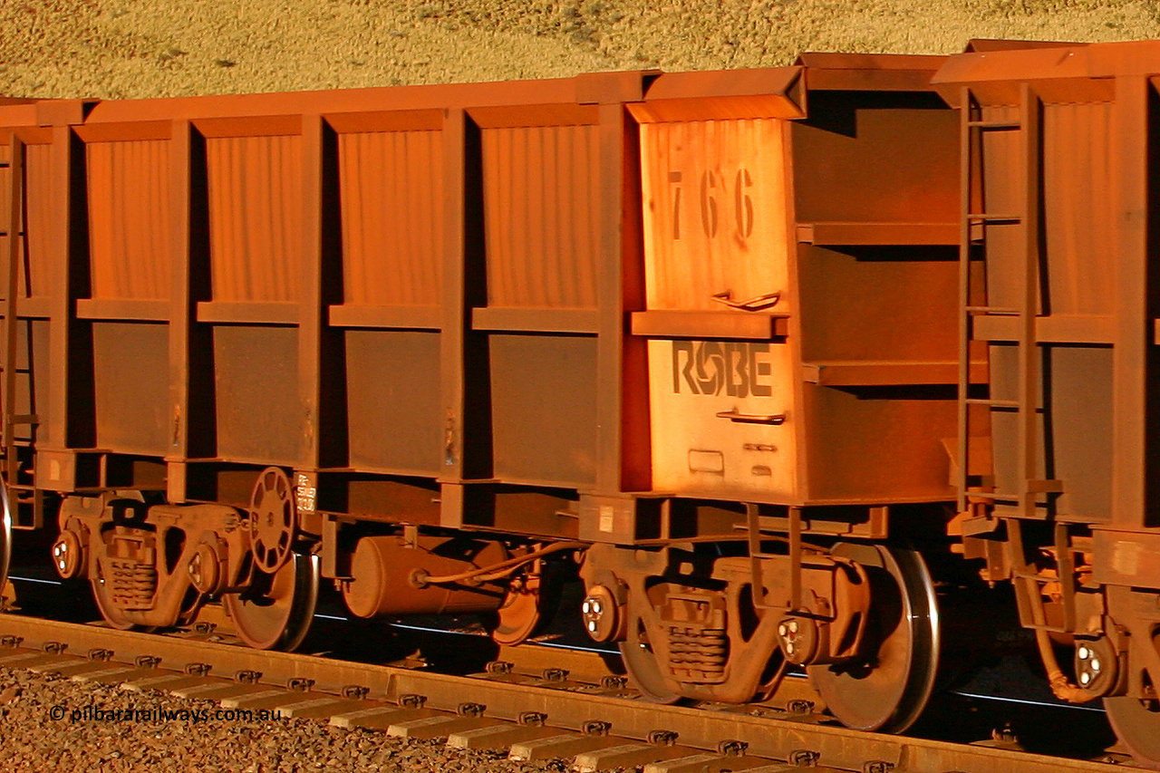 0766 060722 7617
Robe River ore waggon 766, built by Centurion Industries WA, rotary coupler end handbrake side empty partial view, at the 11.7 km, Cape Lambert. July 22, 2006.
Keywords: 766;Centurion-Industries-WA;Robe-ore-waggon;