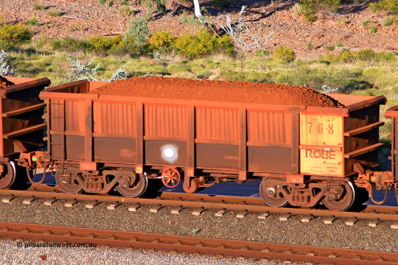 0768 110602 1708
Robe River ore waggon 768, built by Centurion Industries WA, rotary coupler end handbrake side loaded view at the 71 km, Western Creek on the Deepdale line. June 2, 2011.
Keywords: 768;Centurion-Industries-WA;Robe-ore-waggon;