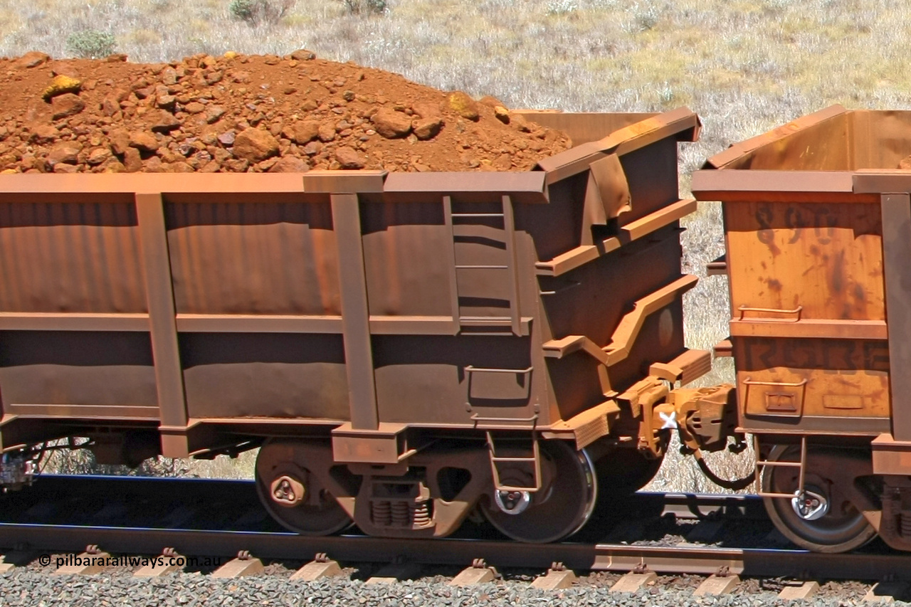 0771 081209 0169
Robe River ore waggon 771, built by Centurion Industries WA, fixed coupler non-handbrake side loaded view showing drop rib end at the 7 km location just south of Cape Lambert yard. December 9, 2008.
Keywords: 771;Centurion-Industries-WA;Robe-ore-waggon;