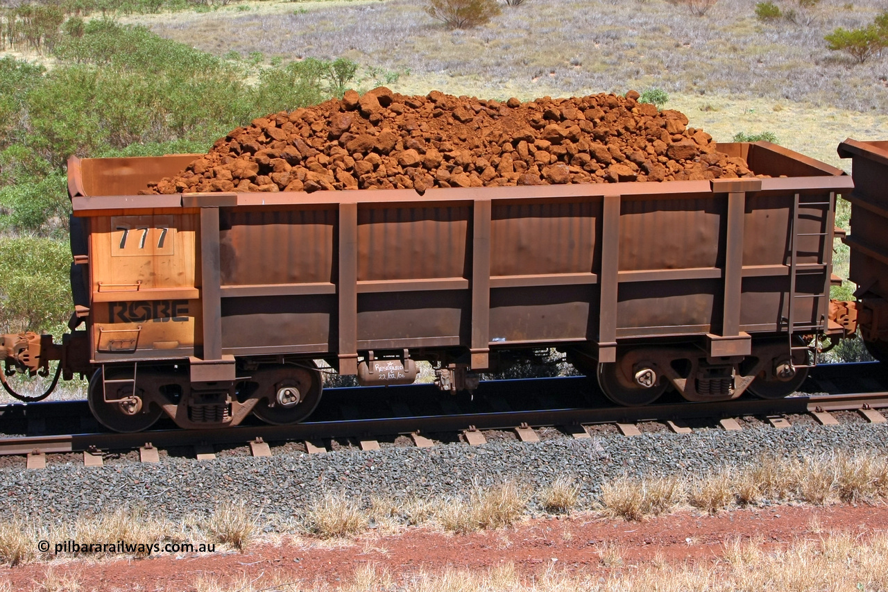 0777 081209 0125
Robe River ore waggon 777, built by Centurion Industries WA, rotary coupler end non-handbrake side loaded view at the 7 km location just south of Cape Lambert yard. December 9, 2008.
Keywords: 777;Centurion-Industries-WA;Robe-ore-waggon;