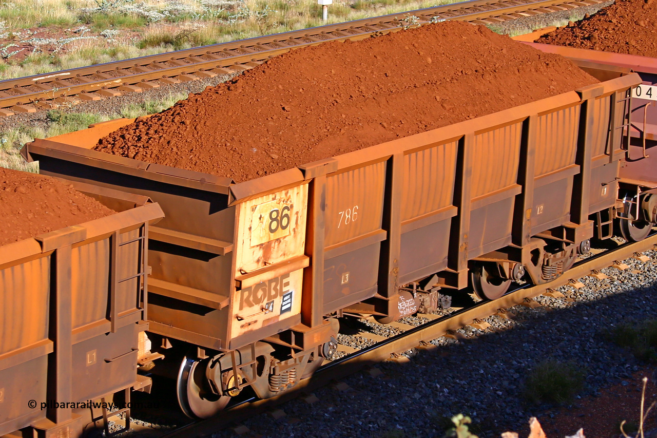 0786 210322 9696
Robe River ore waggon 786, built by Centurion Industries  WA, rotary coupler end non-handbrake side loaded view at the 17 km on the Cape Lambert line, March 22, 2021.
Keywords: 786;Centurion-Industries-WA;Robe-ore-waggon;