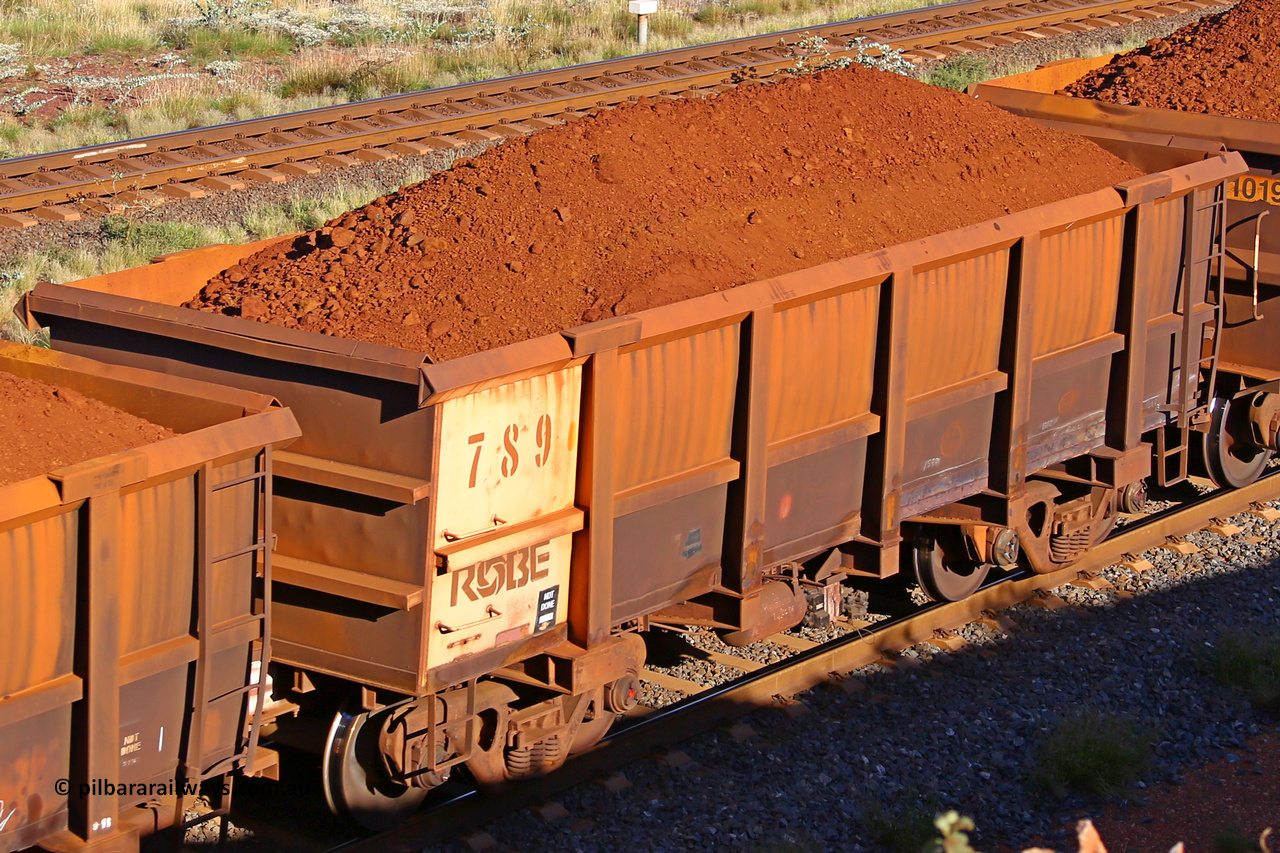 0789 210322 9795
Robe River ore waggon 789, built by Centurion Industries  WA, rotary coupler end non-handbrake side loaded view at the 17 km on the Cape Lambert line, March 22, 2021.
Keywords: 789;Centurion-Industries-WA;Robe-ore-waggon;