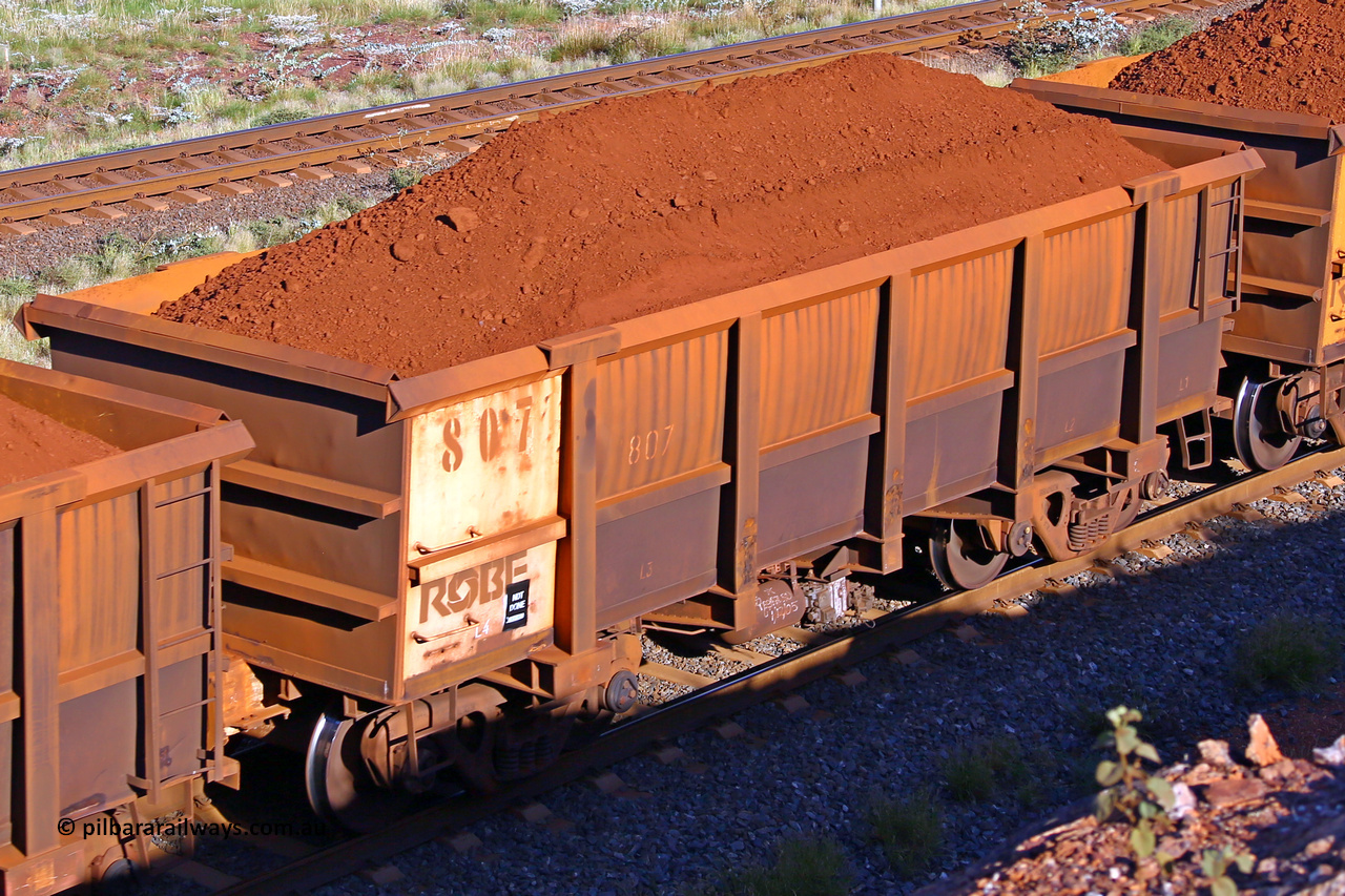 0807 210322 9692
Robe River ore waggon 807, built by Centurion Industries  WA, rotary coupler end non-handbrake side loaded view at the 17 km on the Cape Lambert line, March 22, 2021.
Keywords: 807;Centurion-Industries-WA;Robe-ore-waggon;
