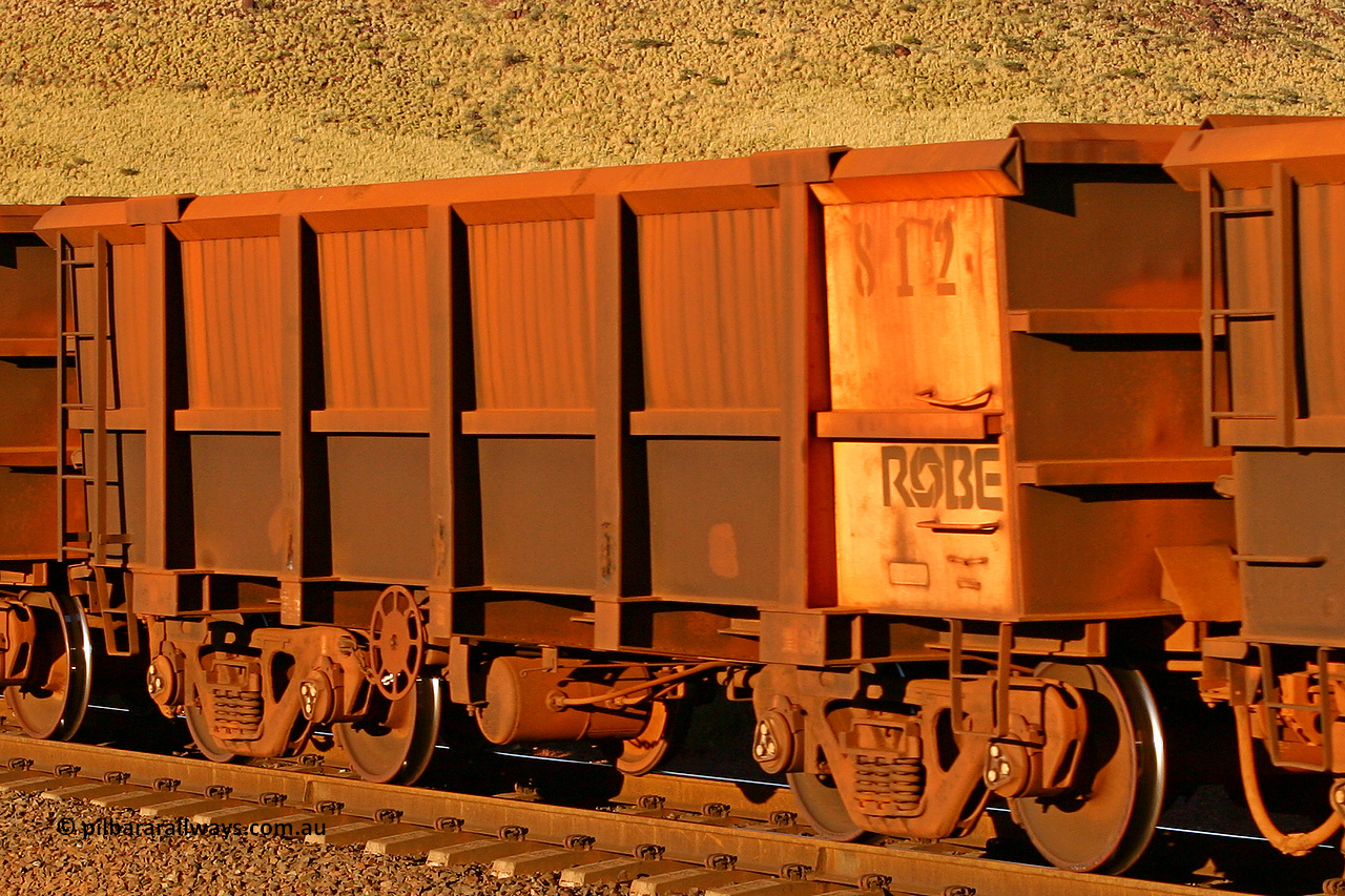 0812 060722 7594
Robe River ore waggon 812, built by Centurion Industries WA, rotary coupler end handbrake side empty view, at the 11.7 km, Cape Lambert. July 22, 2006.
Keywords: 812;Centurion-Industries-WA;Robe-ore-waggon;