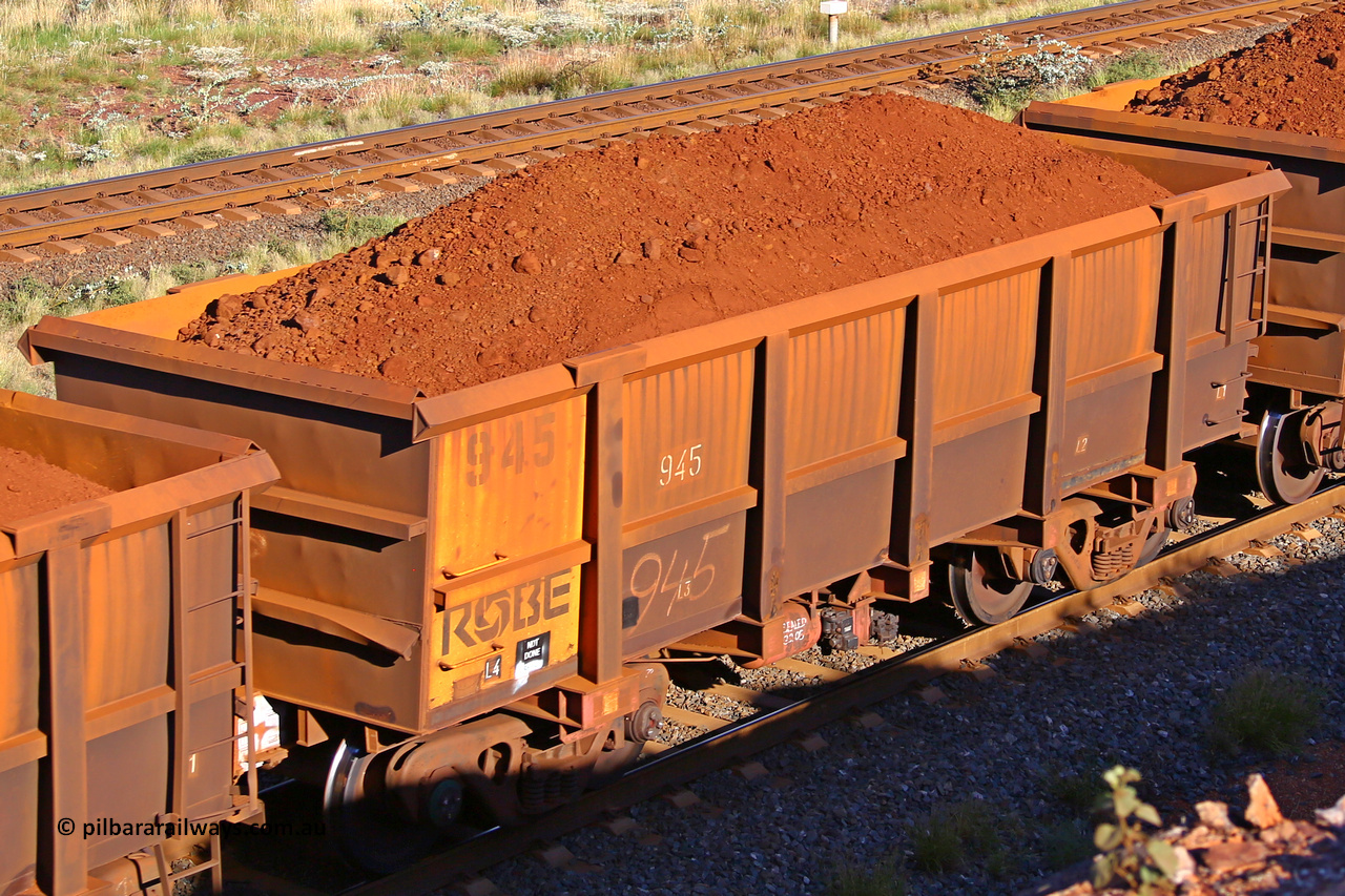 0945 210322 9777
Robe River ore waggon 945, built by Centurion Industries  WA, rotary coupler end non-handbrake side loaded view at the 17 km on the Cape Lambert line, March 22, 2021.
Keywords: 945;Centurion-Industries-WA;Robe-ore-waggon;