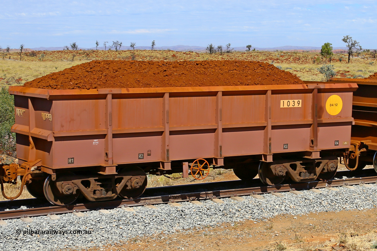 1039 170729 0210
Robe River ore waggon 1039, built by Bradken Rail Qld in April 2012, fixed coupler handbrake side loaded view at the 103 km, between Maitland Siding and the Fortescue River on the Deepdale line. July 29, 2017.
Keywords: 1039;Bradken-Rail-Qld;Robe-ore-waggon;