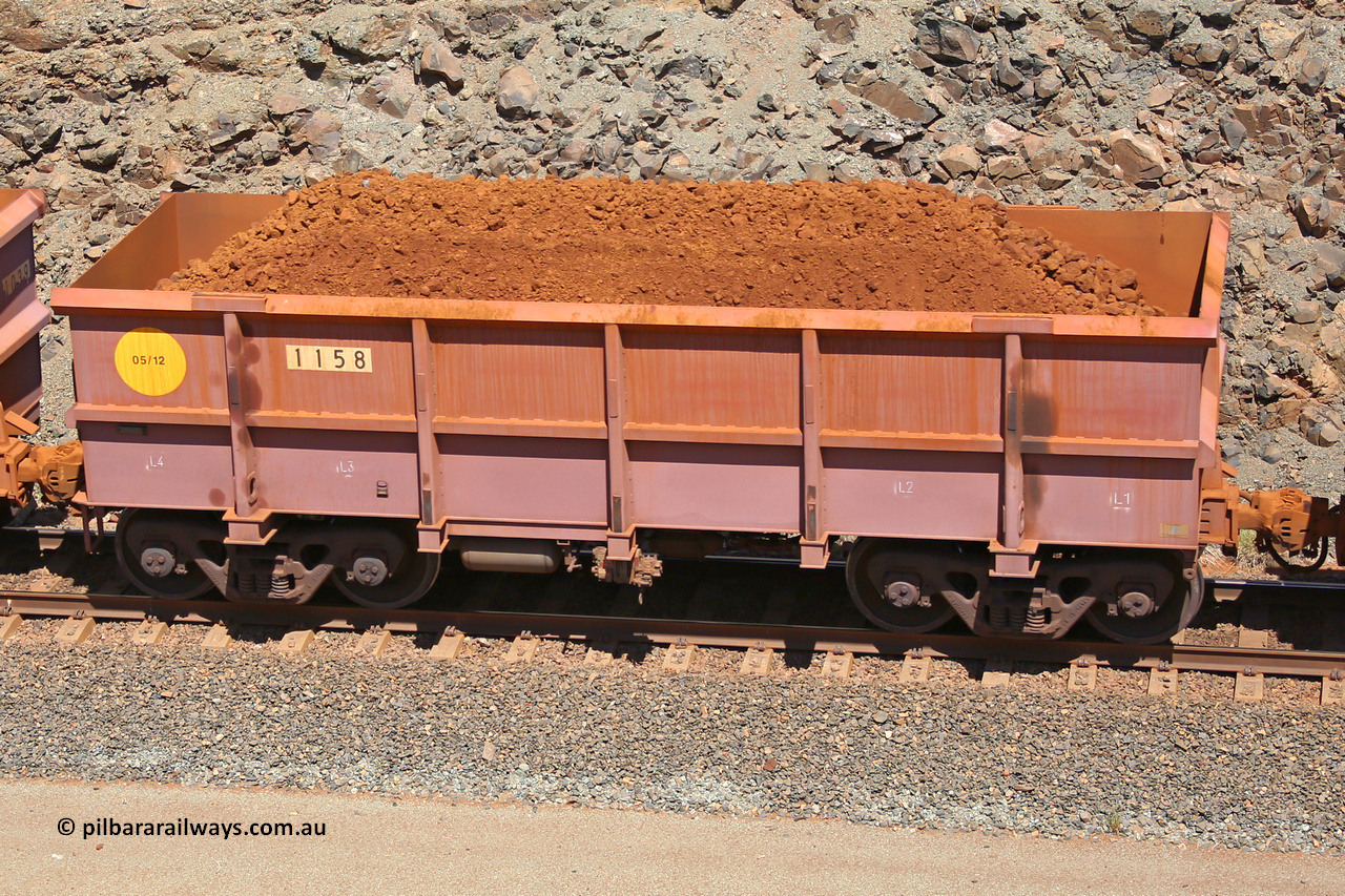 1158 160306 1594
Robe River ore waggon 1158, built by Bradken Rail Qld in May 2012, fixed coupler non-handbrake side loaded view, at the 45 km, Harding Siding on the Cape Lambert line. March 6, 2016.
Keywords: 1158;Bradken-Rail-Qld;Robe-ore-waggon;