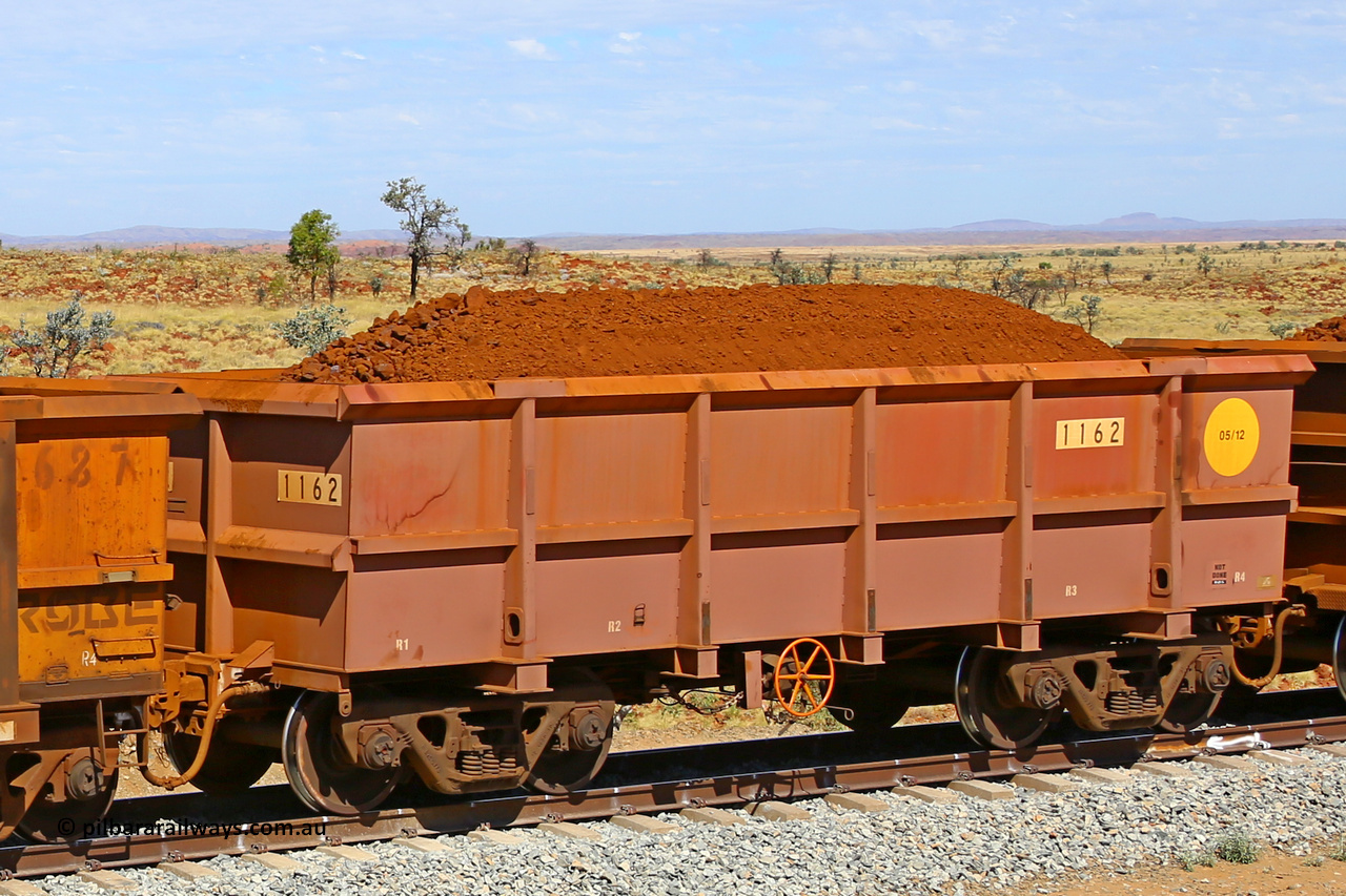 1162 170729 0273
Robe River ore waggon 1162, built by Bradken Rail Qld in May 2012, fixed coupler handbrake side loaded view at the 103 km, between Maitland Siding and the Fortescue River on the Deepdale line. July 29, 2017.
Keywords: 1162;Bradken-Rail-Qld;Robe-ore-waggon;