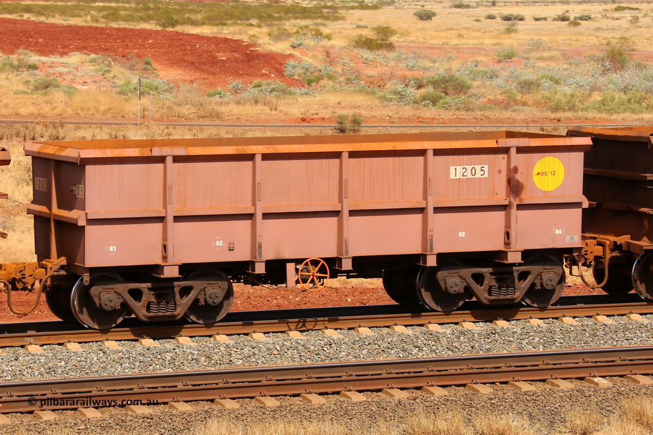 1205 141124 6826
Robe River ore waggon 1205, built by Bradken Rail Qld in May 2012, fixed coupler handbrake side empty view at the 25 km at Arches Siding on the Cape Lambert line. November 24, 2014.
Keywords: 1205;Bradken-Rail-Qld;Robe-ore-waggon;