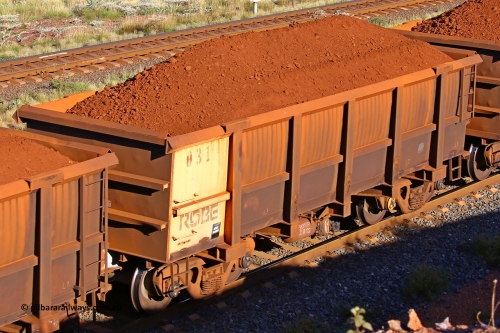 0031 210322 9694
Robe River ore waggon 031, built by Nippon Sharyo Nihon, rotary coupler end non-handbrake side loaded view at the 17 km on the Cape Lambert line, March 22, 2021.
Keywords: 031;Nippon-Sharyo-Nihon;Robe-ore-waggon;