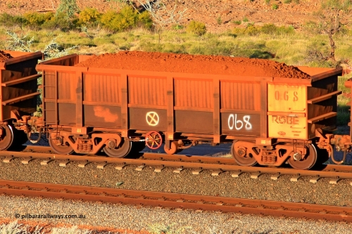 0068 110602 1740
Robe River ore waggon 068, built by Nippon Sharyo Nihon, rotary coupler end handbrake side loaded view at the 71 km, Western Creek on the Deepdale line. June 2, 2011.
Keywords: 068;Nippon-Sharyo-Nihon;Robe-ore-waggon;