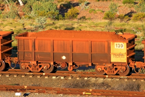 0139 110602 1666
Robe River ore waggon 139, built by Nippon Sharyo Nihon, rotary coupler end handbrake side loaded view at the 71 km, Western Creek on the Deepdale line. June 2, 2011.
Keywords: 139;Nippon-Sharyo-Nihon;Robe-ore-waggon;