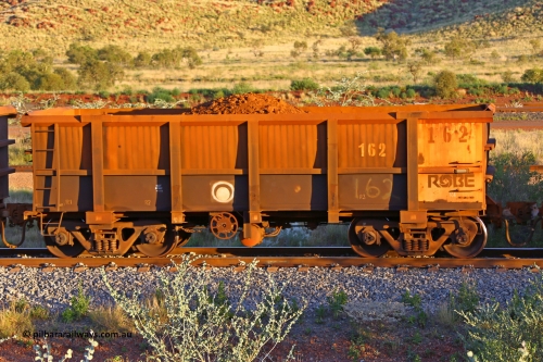 0162 170513 8762
Robe River ore waggon 162, built by Nippon Sharyo Nihon, handbrake side, only partially loaded, view, Cape Lambert yard, May 13, 2017.
Keywords: 162;Nippon-Sharyo-Nihon;Robe-ore-waggon;