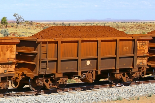0178 170729 0218
Robe River ore waggon 178, built by Nippon Sharyo Nihon, fixed coupler handbrake side loaded view at the 103 km, between Maitland Siding and the Fortescue River on the Deepdale line. July 29, 2017.
Keywords: 178;Nippon-Sharyo-Nihon;Robe-ore-waggon;