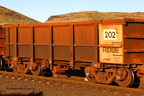 0202 060722 7620
Robe River ore waggon 202, built by Nippon Sharyo Nihon, rotary coupler end handbrake side empty view, at the 11.7 km, Cape Lambert. July 22, 2006.
Keywords: 202;Nippon-Sharyo-Nihon;Robe-ore-waggon;