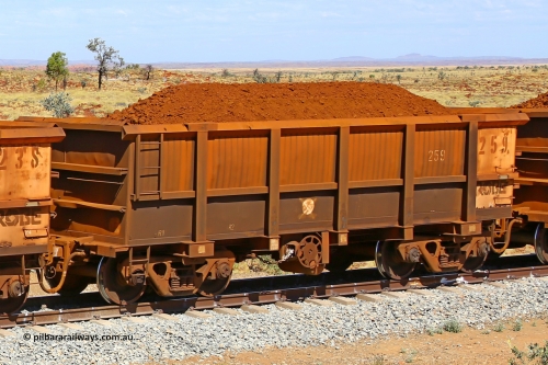 0259 170729 0252
Robe River ore waggon 259, built by Nippon Sharyo Nihon, fixed coupler handbrake side loaded view at the 103 km, between Maitland Siding and the Fortescue River on the Deepdale line. July 29, 2017.
Keywords: 259;Nippon-Sharyo-Nihon;Robe-ore-waggon;