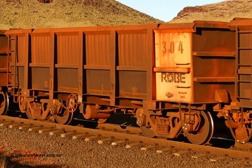 0304 060722 7609
Robe River ore waggon 304, built by Nippon Sharyo Nihon, rotary coupler end handbrake side empty view, at the 11.7 km, Cape Lambert. July 22, 2006.
Keywords: 304;Nippon-Sharyo-Nihon;Robe-ore-waggon;
