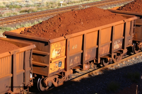 0490 210322 9779
Robe River ore waggon 490, built by Tomlinson Steel WA, rotary coupler end non-handbrake side loaded view at the 17 km on the Cape Lambert line, March 22, 2021.
Keywords: 490;Tomlinson-Steel-WA;Robe-ore-waggon;