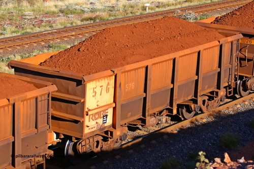 0576 210322 9714
Robe River ore waggon 576, built by Tomlinson Steel WA, rotary coupler end non-handbrake side loaded view at the 17 km on the Cape Lambert line, March 22, 2021.
Keywords: 576;Tomlinson-Steel-WA;Robe-ore-waggon;