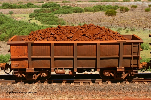 0711 061209 8190
Robe River ore waggon 711, built by Tomlinson Steel WA, fixed coupler non-handbrake side loaded view at the 7 km location just south of Cape Lambert yard. December 9, 2006.
Keywords: 711;Tomlinson-Steel-WA;Robe-ore-waggon;