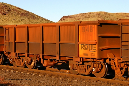 0948 060722 7619
Robe River ore waggon 948, built by Centurion Industries WA, rotary coupler end handbrake side empty view, at the 11.7 km, Cape Lambert. July 22, 2006.
Keywords: 948;Centurion-Industries-WA;Robe-ore-waggon;