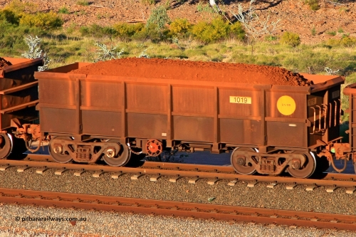 1019 110602 1702
Robe River ore waggon 1019, built by Bradken Rail Qld in January 2006, rotary coupler end handbrake side loaded view at the 71 km, Western Creek on the Deepdale line. June 2, 2011.
Keywords: 1019;Bradken-Rail-Qld;Robe-ore-waggon;