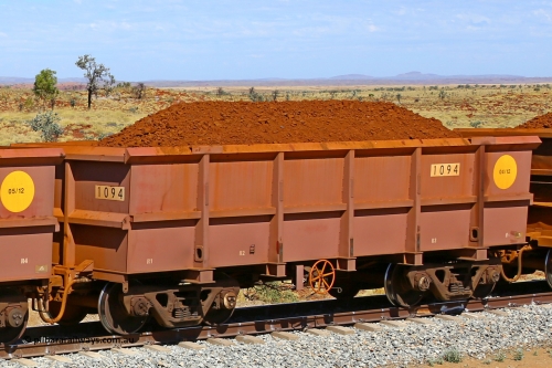 1094 170729 0215
Robe River ore waggon 1094, built by Bradken Rail Qld in April 2012, fixed coupler handbrake side loaded view at the 103 km, between Maitland Siding and the Fortescue River on the Deepdale line. July 29, 2017.
Keywords: 1094;Bradken-Rail-Qld;Robe-ore-waggon;