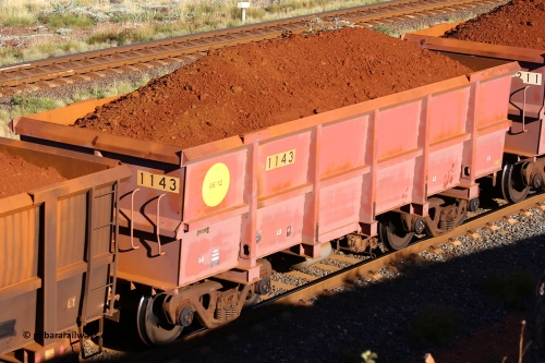 1143 210322 9736
Robe River ore waggon 1143, built by Bradken Rail Qld in May 2012, rotary coupler end non-handbrake side loaded view, at the 17 km on the Cape Lambert line, March 22, 2021.
Keywords: 1143;Bradken-Rail-Qld;Robe-ore-waggon;