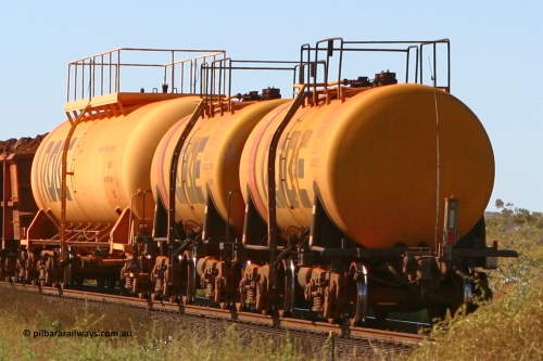 8001 060716 7203
Robe River diesel fuel tank waggon 8001 running empty on the rear of a loaded ore train, built by Comeng NSW in September 1972 with a 45,000 litre capacity, end of train view at the 71 km on the Deepdale line, Western Creek, July 16, 2006.
Keywords: 8001;Comeng-NSW;Robe-tank-waggon;
