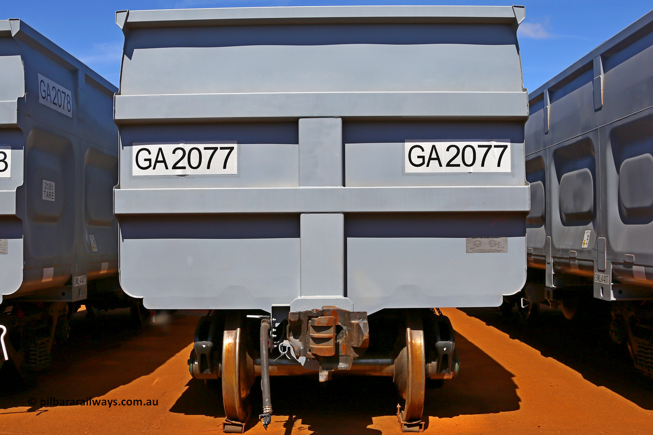 150314 7767
Wedgefield, following the delivery of Roy Hill's 1196 new GA type CCK138 model waggons, they were stored in several site whilst awaiting for enough track to be laid to allow delivery onto rail. GA2077 end view showing fixed end, only the even numbered waggons, or control waggon, has an uncoupling lever, the odd numbered, or slave waggons do not. March 14. 2015.
Keywords: GA-type;GA2077;CSR-Yangtze;CCK138