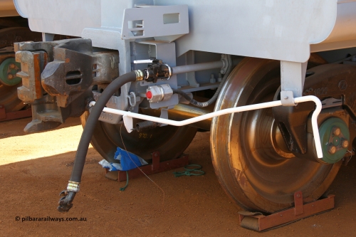 150314 7789
Wedgefield, following the delivery of Roy Hill's 1196 new GA type CCK138 model waggons, they were stored in several site whilst awaiting for enough track to be laid to allow delivery onto rail. GA2144 end view showing the F type coupler, hose and electrical connection and uncoupling lever, only the even numbered waggons, or control waggon, has an uncoupling lever, the odd numbered, or slave waggons do not. March 14. 2015.
Keywords: GA-type;GA2214;CSR-Yangtze;CCK138;