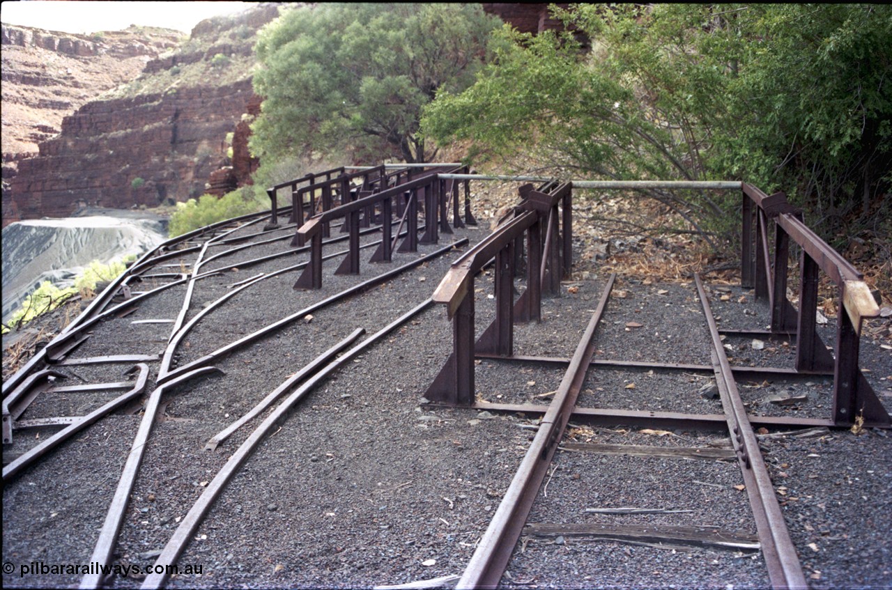194-15
Wittenoom, Colonial Mine, asbestos mining remains, railway workshops with loco storage roads, the raised ramps are for removing the battery modules off the locomotives.
