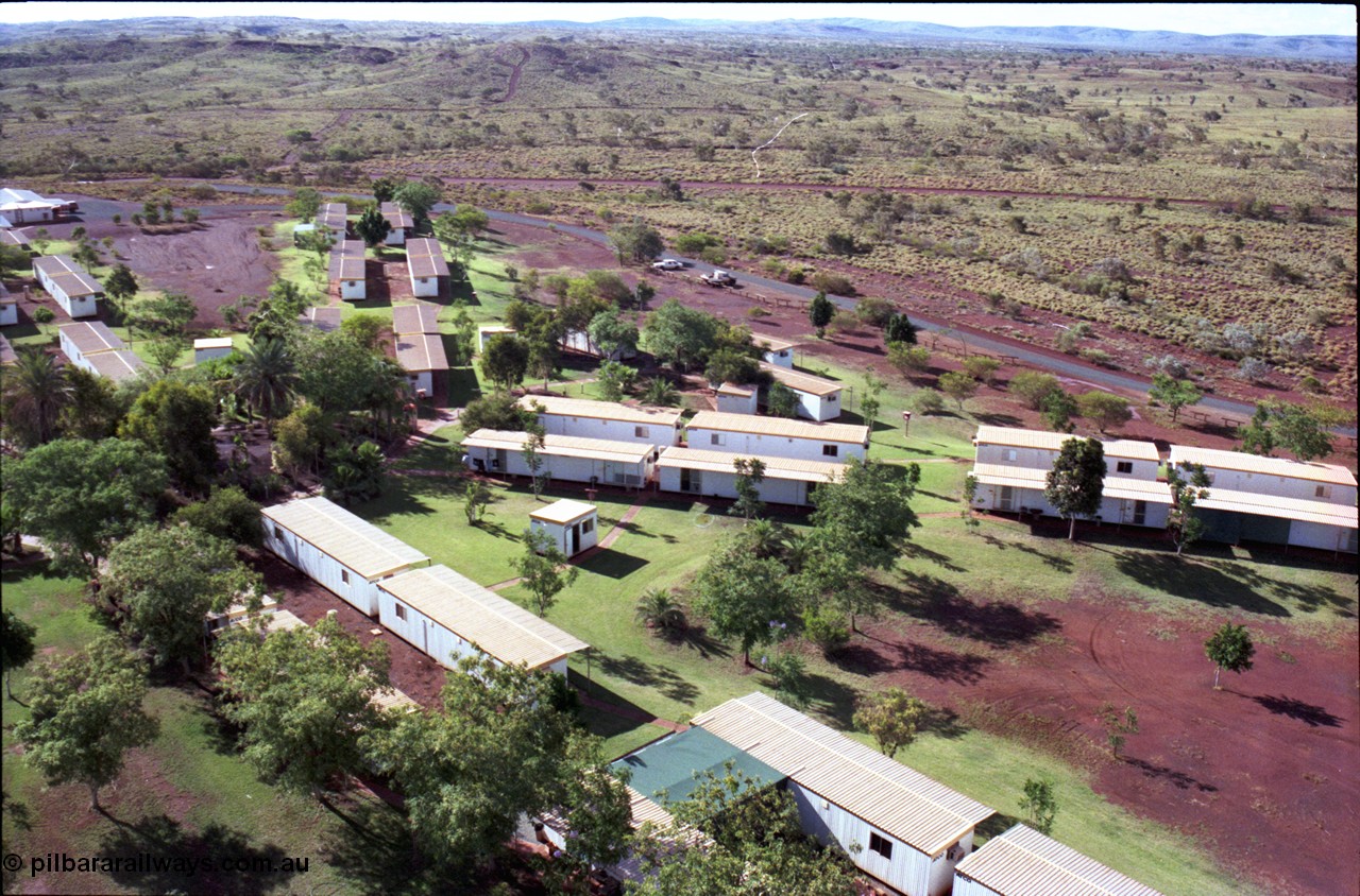 194-29
Yandi campsite for Henry Walker operated iron ore mine owned and managed by BHP, view of camp are from man cage on Kato 50 tonne hydraulic crane.
