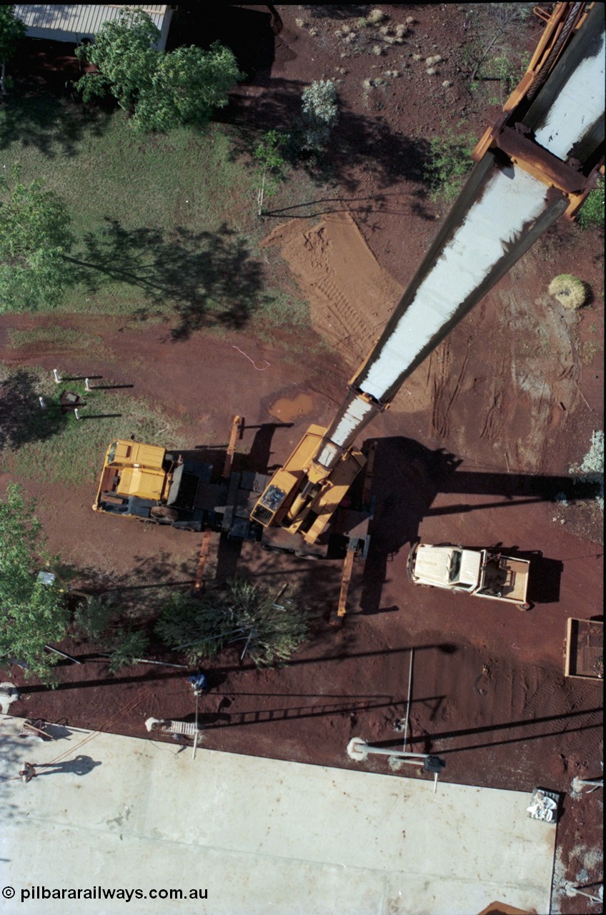194-34
Yandi campsite for Henry Walker operated iron ore mine owned and managed by BHP, view of Kato 50 tonne hydraulic crane from man cage at full stick.
