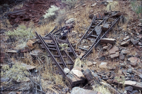 194-02
Wittenoom Gorge, Colonial Mine, asbestos mining remains, pile of railway points or switches, two left handed and one right handed.
