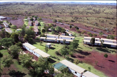194-29
Yandi campsite for Henry Walker operated iron ore mine owned and managed by BHP, view of camp are from man cage on Kato 50 tonne hydraulic crane.
