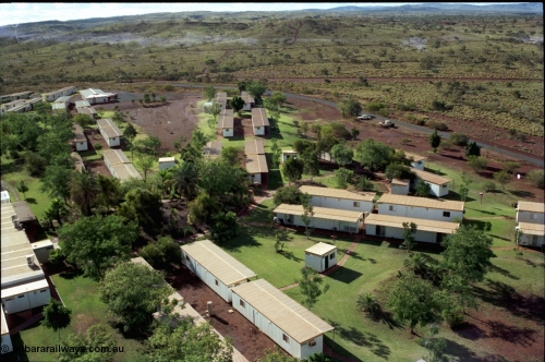 194-37
Yandi campsite for Henry Walker operated iron ore mine owned and managed by BHP, view of camp are from man cage on Kato 50 tonne hydraulic crane.
