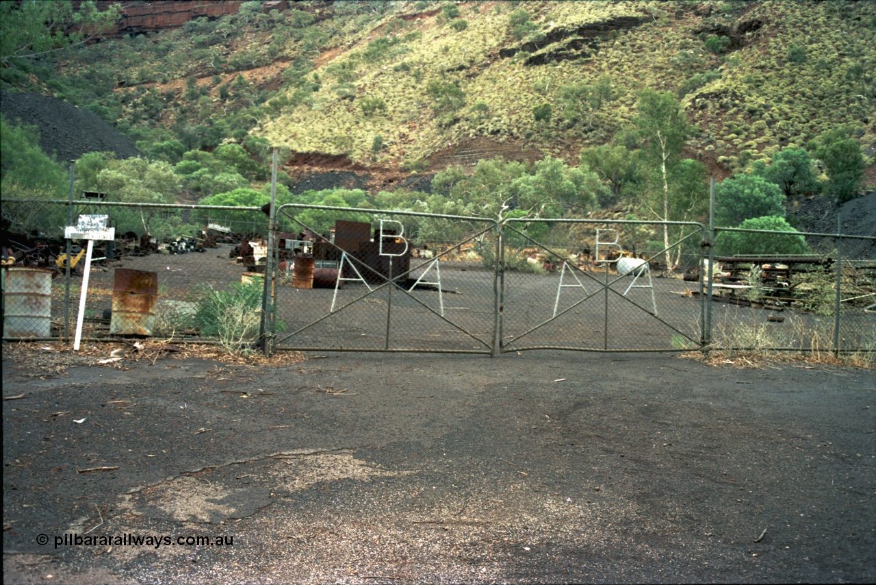 195-23
Wittenoom Gorge, Australian Blue Asbestos or ABA Colonial Mill, view of the gates on the warehouse fenced yard.
