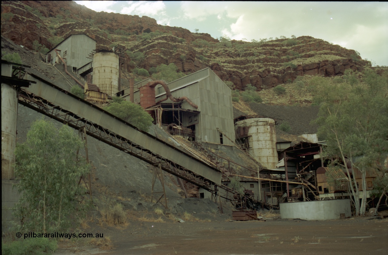 195-27
Wittenoom Gorge, Australian Blue Asbestos or ABA Colonial Mill, view looking up past the drier level with the crusher building at the top.
