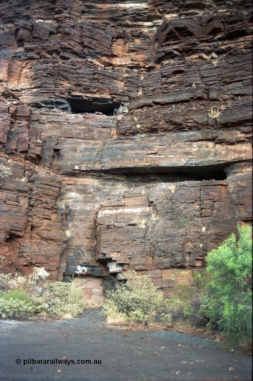 195-31
Wittenoom, West Gorge, Australian Blue Asbestos or ABA Colonial Mine, sealed up underground drive adit or entry no. 30, shows area where seams have been cut out from the rock face.
