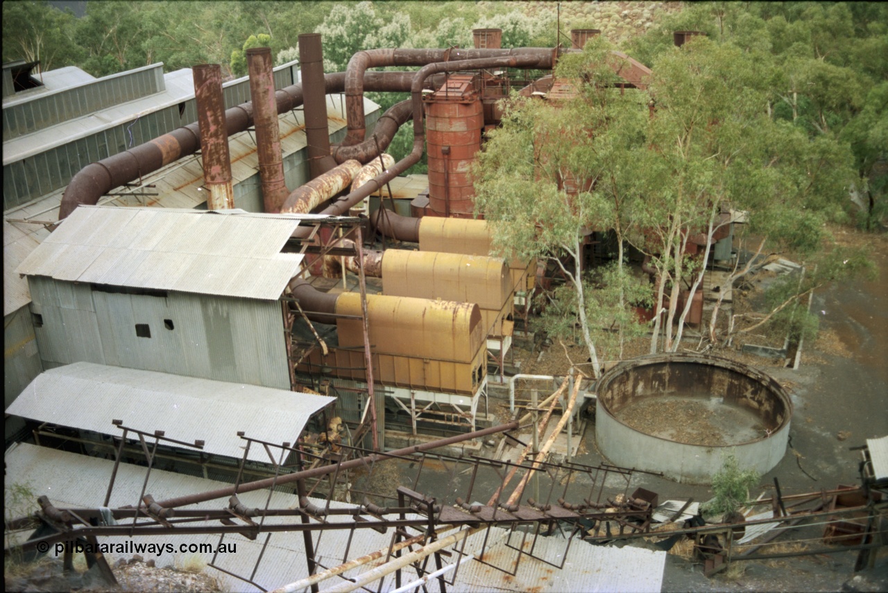 195-34
Wittenoom Gorge, Australian Blue Asbestos or ABA Colonial Mill, overview from the drier level looking down on the mills and dust collectors.
