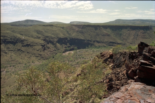 195-18
Wittenoom Gorge, view looking south down the gorge, the Colonial Mine is on the right and not visible behind the rock. The former market garden area can be just seen at the bottom left of image as Bolitho Rd cuts through the middle.
