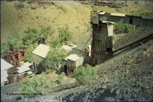 195-35
Wittenoom Gorge, Australian Blue Asbestos or ABA Colonial Mill, overview from the crusher level, looking down on the holding bin/silo and drier and milling plant.
